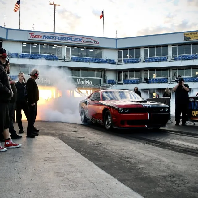 Lee Hartman's Challenger Drag Pak doing a burnout at Texas Motorplex