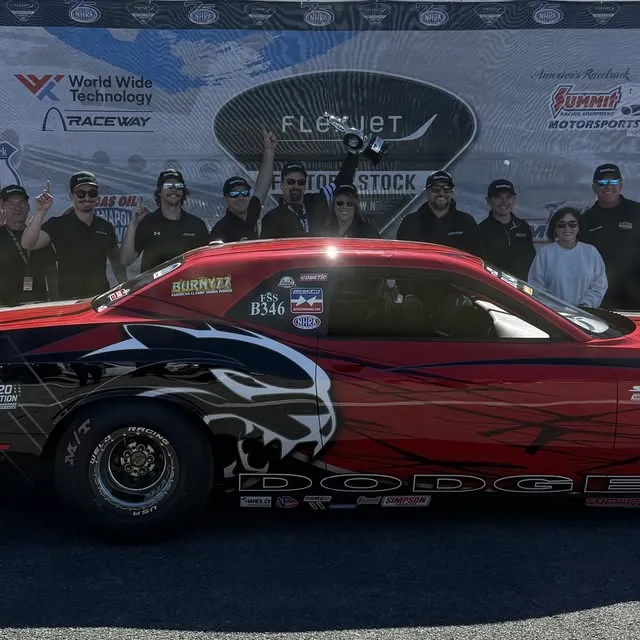 Lee Hartman and the team with the Challenger in the St. Louis winner's circle